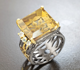 Серебряное кольцо с резным цитрином 11 карат и голубыми топазами