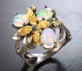 Серебряное кольцо с кристаллическими эфиопскими опалами, голубыми топазами и синим сапфиром