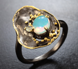 Серебряное кольцо с кристаллическим эфиопским опалом и бесцветным топазом