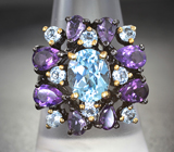 Серебряное кольцо с голубыми топазами и аметистами