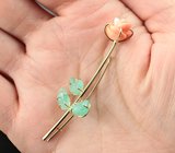 Золотая брошь с резным solid кораллом 4,17 карата и уральскими изумрудами