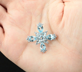 Серебряная брошь-крест с голубыми топазами