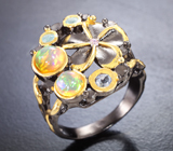 Серебряное кольцо с кристаллическими эфиопскими опалами, танзанитом и голубыми топазами
