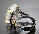 Серебряное кольцо с бесцветным кварцем 22,71 карата и аметистами