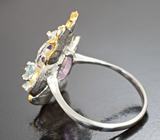 Серебряное кольцо с аметистом и голубыми топазами