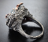 Серебряное кольцо с голубыми топазами, родолитами и альмандинами гранатами