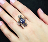 Серебряное кольцо с крупным синим сапфиром и рубинами