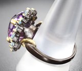 Серебряное кольцо с аметистом лазерной огранки 9,06 карата и голубыми топазами