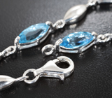 Изящный серебряный браслет с голубыми топазами