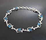 Изысканный серебряный браслет с насыщенно-синими топазами
