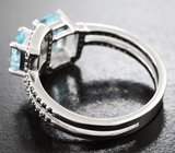Серебряное кольцо с голубыми топазами и черными шпинелями