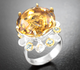 Серебряное кольцо с цитрином и голубыми топазами