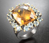 Серебряное кольцо с крупным цитрином и голубыми топазами