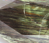 Перидот с включениями рутила 4,39 карата 