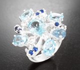 Серебряное кольцо с голубыми топазами
