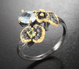 Серебряное кольцо с голубым топазом и перидотом