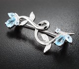 Прелестная серебряная брошь с голубыми топазами
