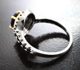 Эффектное серебряное кольцо с насыщенно-синим сапфиром и черными шпинелями Серебро 925