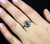 Эффектное серебряное кольцо с насыщенно-синим сапфиром и черными шпинелями Серебро 925