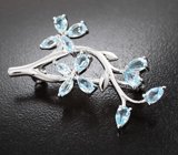Изысканная серебряная брошь с голубыми топазами