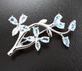 Изысканная серебряная брошь с голубыми топазами
