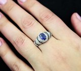 Эффектное серебряное кольцо с синим сапфиром и черными шпинелями Серебро 925