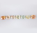 Брошь с зеленым апатитом авторской огранки 4,39 карата, спессартинами гранатами 5,47 карата, цаворитами гранатами 3,79 карата, разноцветными и бесцветными сапфирам