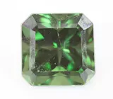 Брошь с зеленым апатитом авторской огранки 4,39 карата, спессартинами гранатами 5,47 карата, цаворитами гранатами 3,79 карата, разноцветными и бесцветными сапфирам