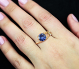 Золотое кольцо с ярким насыщенным танзанитом 0,82 карата и бесцветным топазом Золото