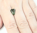 Перидот с включениями рутила авторской огранки 3,11 карата