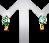 Золотые серьги с зеленовато-голубыми и бесцветными муассанитами 1,93 карата