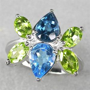 Кольцо с голубыми топазами и перидотами