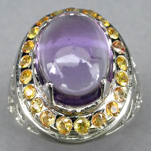 Кабошон аметиста в кольце сапфиров