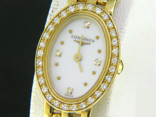 Золотые женские часы с бриллиантами от «Longines»