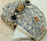 Ажурный браслет с дымчатым топазом и ониксами