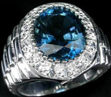 Кольцо с насыщеным голубым топазом и цирконами Серебро 925
