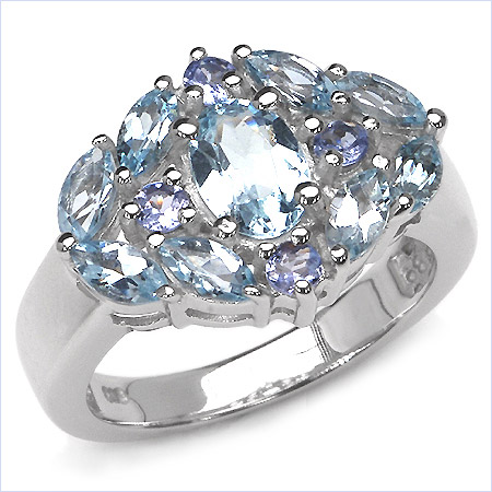 Кольцо с ярким голубым топазом и иолитами