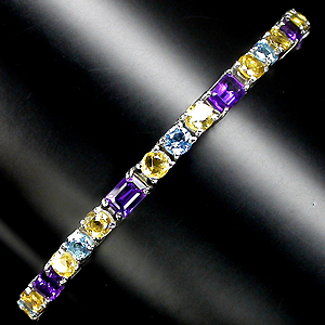 Изящный браслет с аметистами, цитринами и топазами