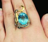 Серебряное кольцо с голубым топазом, синими сапфирами и рубинами Серебро 925