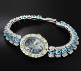 Часы с перидотами на серебряном браслете с голубыми топазами Серебро 925