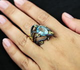 Серебряное кольцо с голубым топазом, цаворитами и синими сапфирами Серебро 925