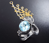 Серебряное кольцо с голубым топазом и синими сапфирами