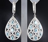 Крупные ажурные серебряные серьги с голубыми топазами