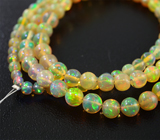 117 кристаллических эфиопских опалов 32 карата на струне 