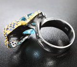 Серебряное кольцо с голубым топазом и синими сапфирами