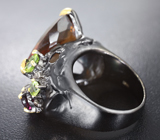 Серебряное кольцо с «коньячным» цитрином 19 карат, родолитом и перидотами