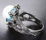 Серебряное кольцо с жемчужиной, голубыми топазами и мозамбикскими гранатами Серебро 925