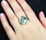 Серебряное кольцо с голубым топазом лазерной огранки 8,84 карата, аквамаринами и синими сапфирами
