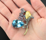 Серебряная брошь с голубым 18,5 карата и бесцветными топазами, резными шпинелями 6,69 карата, аквамарином и синим сапфиром Серебро 925