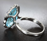 Серебряное кольцо с голубым топазом 11,05 карата и синими сапфирами